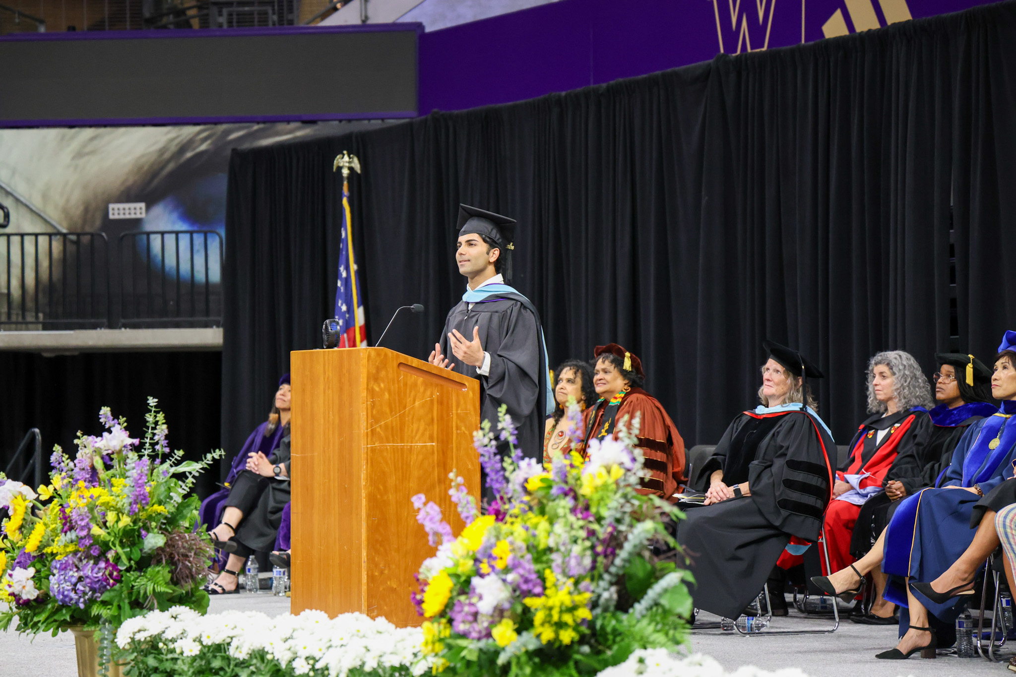graduate student speaker giving remarks